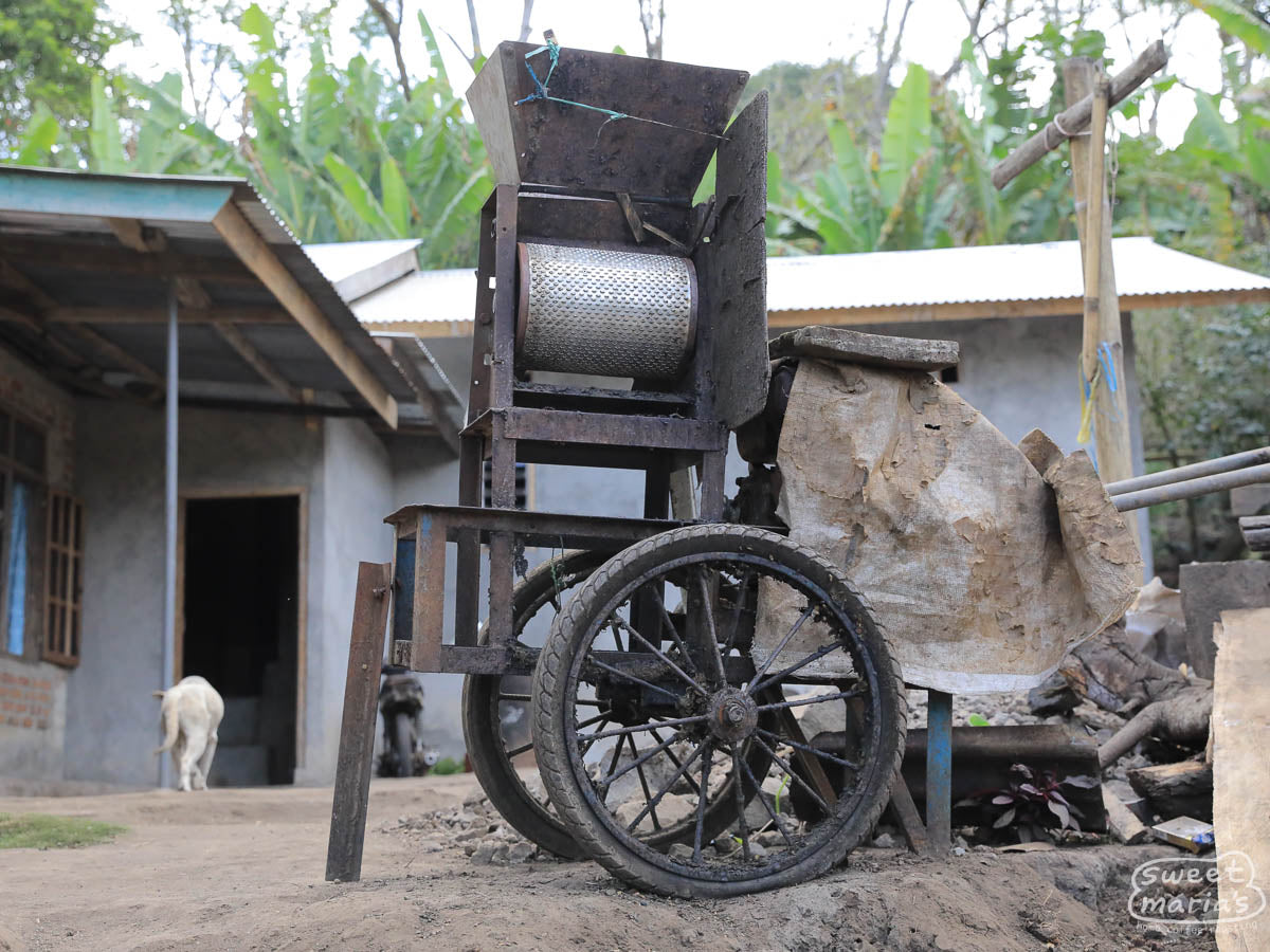 A rolling coffee depulper at one cooperative member's home is shared by many neighbors during the harvest (and easily moved!).