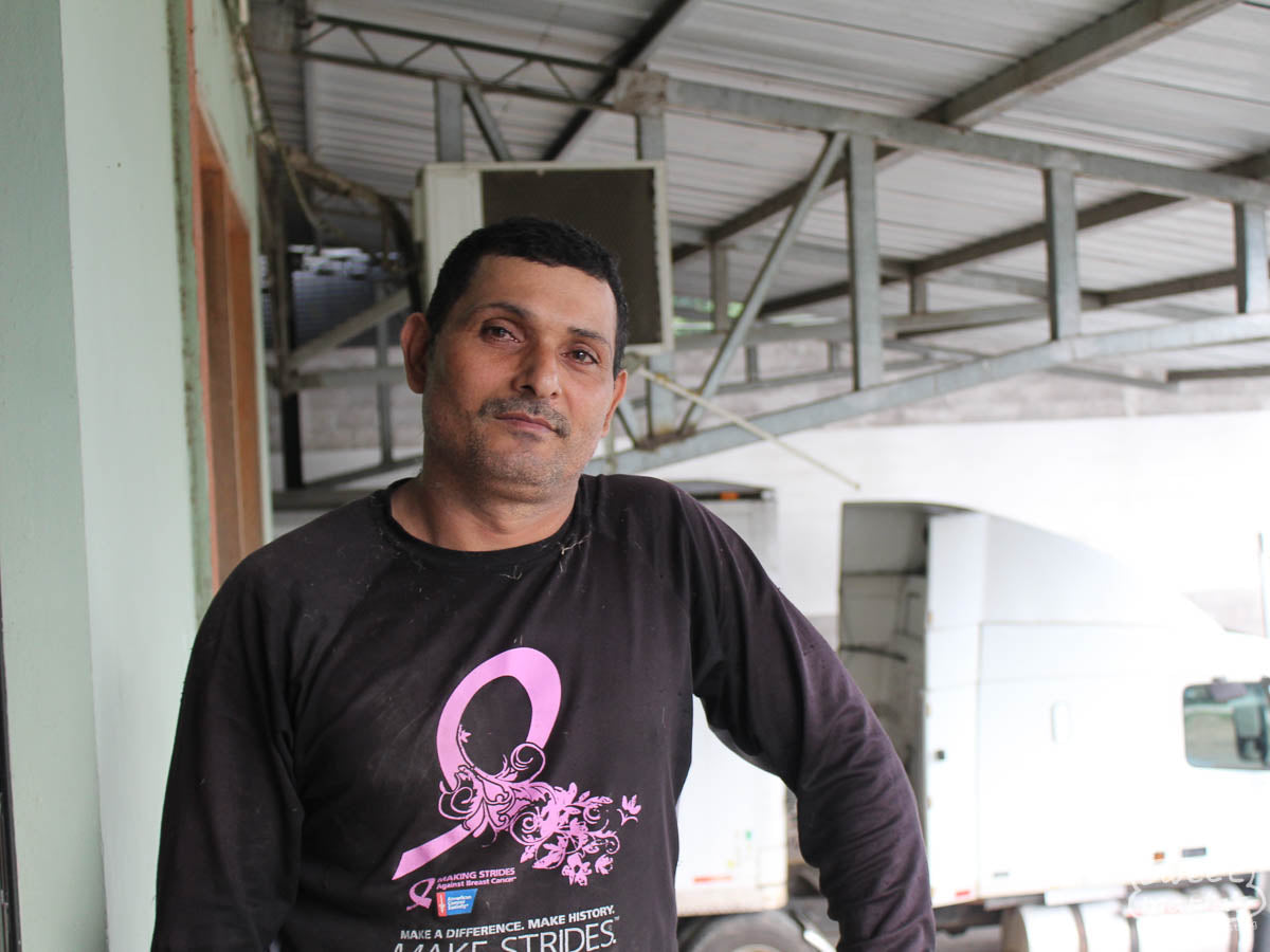 Coffee farmer Anibal Baca poses for a photo at the San Vicente mill in Santa Barbara, Honduras.