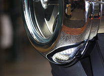 Close up of the glass viewing window in the front of the Hottop roasting drum