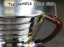 Large Wave 185 Stainless Steel Dripper by Kalita has a brown plastic handle that feels nice in your hand
