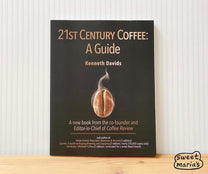 Kenneth Davids 21st Century Coffee: A guide. Both a great read and a great reference manual for coffee from tree to cup.