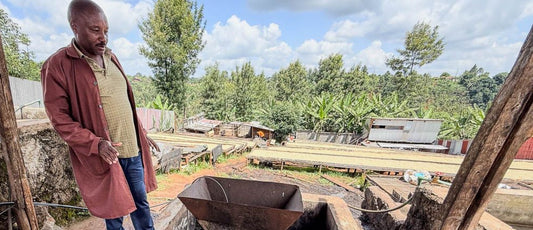 Farm manager, Moses, shows us the pulper and cement fermentation tank at Spike coffee farm in Kiambu, Kenya.