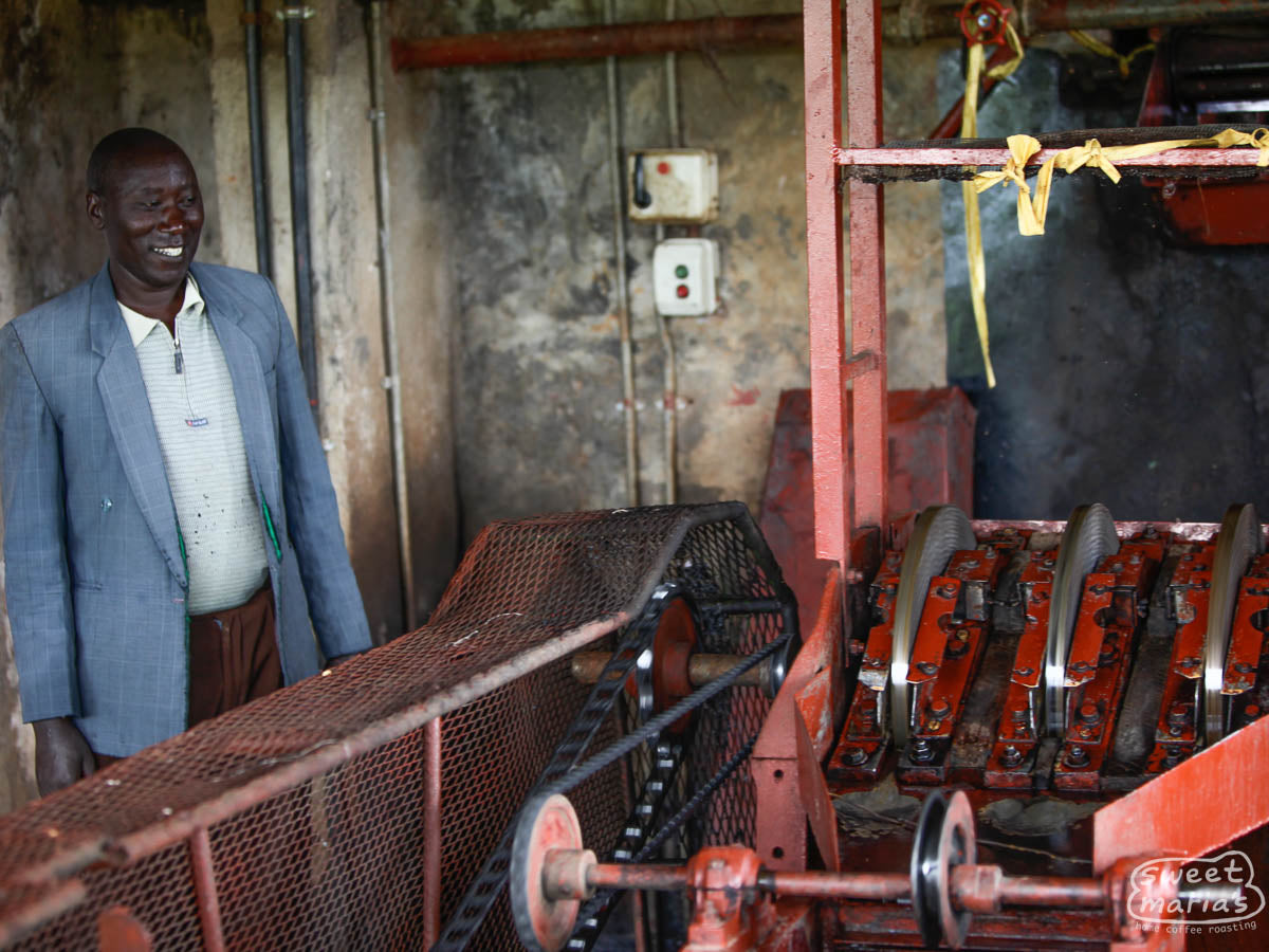 Peter Macheriya, who was the manager of Kiamabara Factory when we visited back in 2009, shows us their 3 disc coffee pulper.