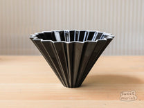 The Origami Ceramic Coffee Dripper, Size Medium, can use Hario V60 or Kalita Wave type filters