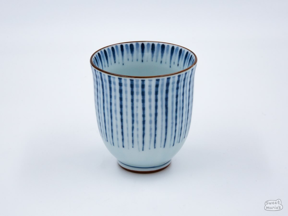 The Blue Tokusa Cup features a striped Tokusa pattern with bronze accents.