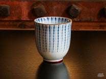 The Blue Tokusa Cup features a striped Tokusa pattern with bronze accents.