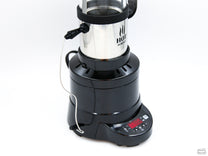 The bean temperature probe inserts into the side of the roast chamber and connects to the bottom of the roaster via cable.