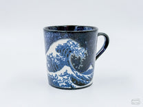 The Namako Blue Great Wave Mug features the eponymous Japanese woodblock print, "The Great Wave Off Kanagawa" by Hokusai.