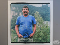 Film photo of Aler Villatoro at his coffee farm in Peña Blanca (you can see the white cliffs behind him).