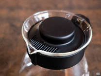 The Hario V60 Glass Carafe features a pop-off lid with simple flow control.