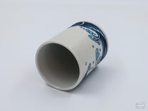 A close up of the Red Seabream & Waves Cup's pebble-like texture.