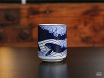 The Sad Whale Ceramic Cup features not just one