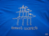 The graphic is printed in a nice peach color on a true royal blue shirt.